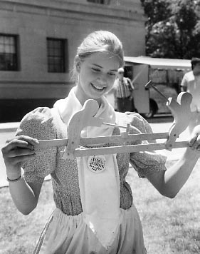 Girl with wooden toy