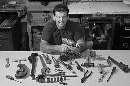 Matt Wilkinson of Ashford, Boone County, with his collection of hand-carved wooden tools