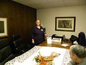 Susan Scouras with the 10th Anniversary Cake