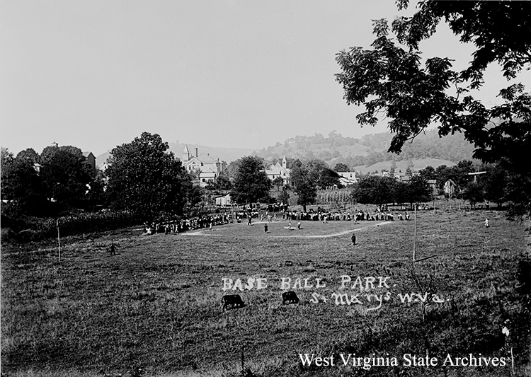 Baseball field with a game in progress, cows grazing in the outfield, St. Marys. Hazael Coleman Williams, photographer. Mark Williams Collection, West Virginia State Archives (214411)