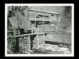 Lump of coal on cribbing in car at mine Number 251, with men at work. This picture is also found in the DeHaven Collection, Roll 1601 10.