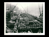 Power house during the hydroelectric power construction on the New River. View looking upstream showing forms and reinforcing steel for generator floor of Unit No. 5 ready for concreting. New-Kanawha Power Company, Hawks Nest - Gauley Junction Development No. 287.