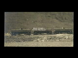 Monongahela Valley Traction Company tank cars on tracks with hillside behind.