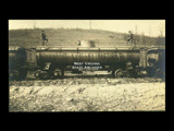 Close-up of Monongahela Valley Traction Company tank car with two  men on top.