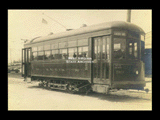 Monongahela Valley Traction Company car No. 90 (Locust Avenue sign) at Fairmont barn. Brick street.